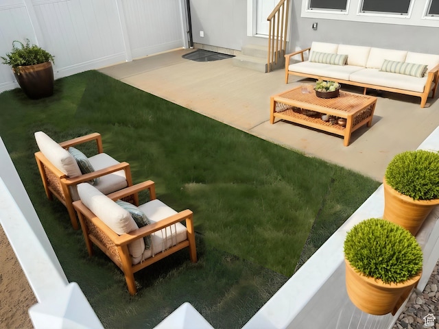 view of yard featuring entry steps and an outdoor living space