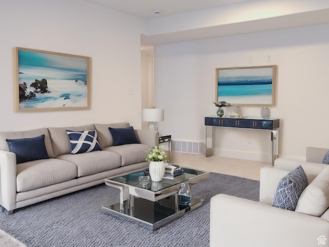 carpeted living area with visible vents