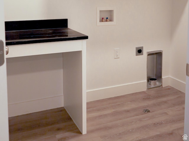 clothes washing area featuring laundry area, baseboards, wood finished floors, washer hookup, and electric dryer hookup