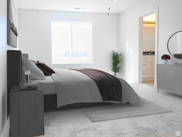 bedroom with ensuite bath, visible vents, and a sink