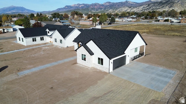 birds eye view of property with a mountain view