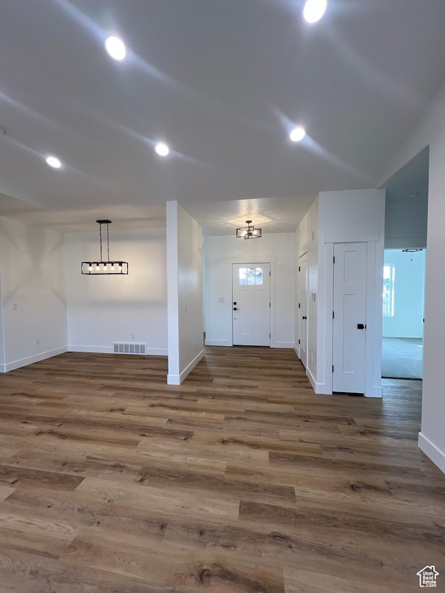 entryway featuring recessed lighting, wood finished floors, visible vents, and baseboards