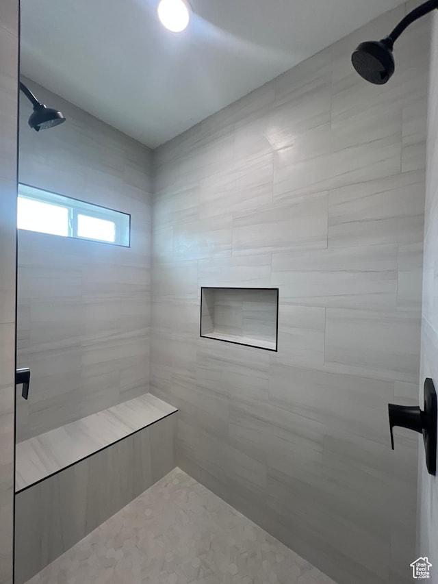 bathroom featuring a sauna and a tile shower