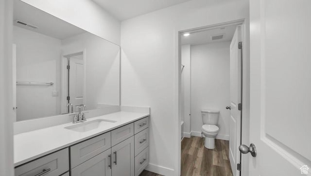 1726 S Wolverine Way Unit 174, Washington, UT 84780 - bathroom with vanity, toilet, visible vents, tub / shower combination, and wood finished floors