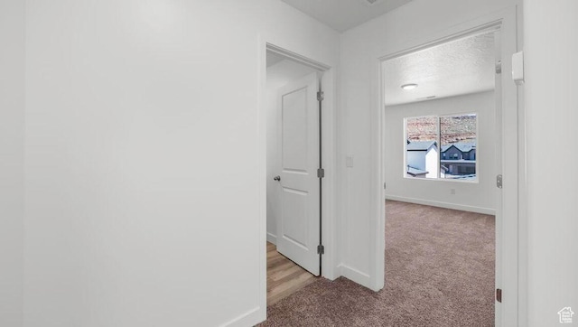 1726 S Wolverine Way Unit 174, Washington, UT 84780 - hall featuring carpet and baseboards