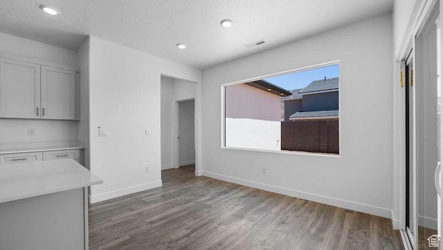 1726 S Wolverine Way Unit 174, Washington, UT 84780 - unfurnished dining area featuring wood finished floors, recessed lighting, visible vents, and baseboards