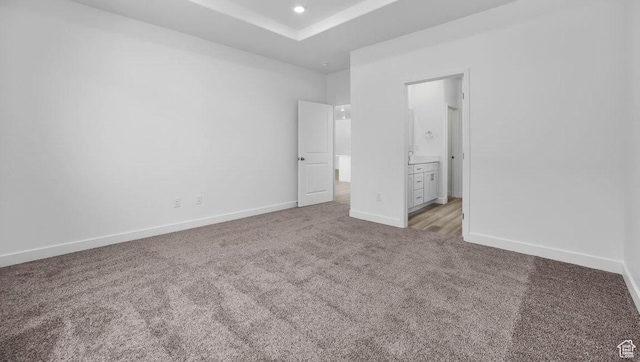 1726 S Wolverine Way Unit 174, Washington, UT 84780 - unfurnished bedroom featuring recessed lighting, connected bathroom, a tray ceiling, carpet, and baseboards