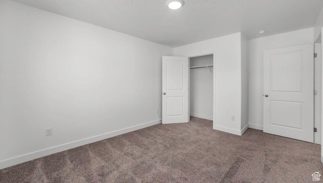 1726 S Wolverine Way Unit 174, Washington, UT 84780 - unfurnished bedroom featuring baseboards, carpet floors, and a closet