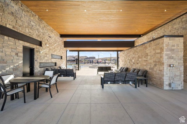 1726 S Wolverine Way Unit 174, Washington, UT 84780 - view of patio featuring an outdoor living space with a fireplace and outdoor dining area
