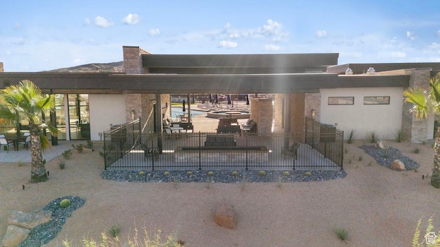 1726 S Wolverine Way Unit 174, Washington, UT 84780 - rear view of house featuring stucco siding and a patio