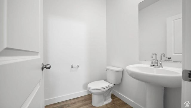 1726 S Wolverine Way Unit 174, Washington, UT 84780 - half bathroom with wood finished floors, toilet, and baseboards