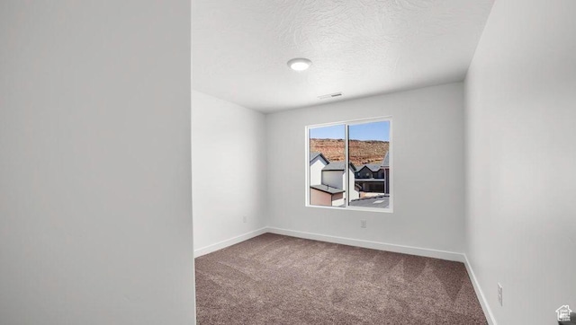 1726 S Wolverine Way Unit 174, Washington, UT 84780 - carpeted empty room featuring baseboards, visible vents, and a textured ceiling