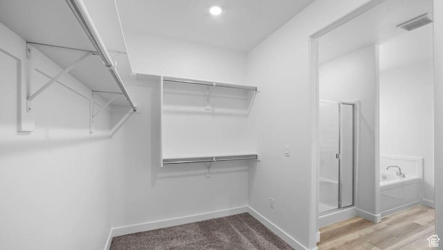 1726 S Wolverine Way Unit 174, Washington, UT 84780 - walk in closet with visible vents and wood finished floors