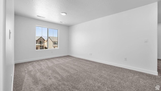 1726 S Wolverine Way Unit 174, Washington, UT 84780 - empty room featuring visible vents, baseboards, and carpet floors