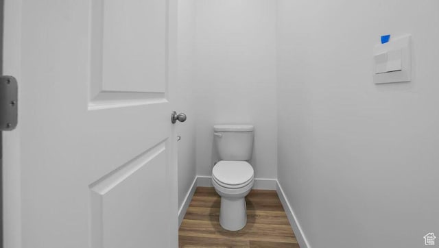 1726 S Wolverine Way Unit 174, Washington, UT 84780 - bathroom featuring toilet, wood finished floors, and baseboards