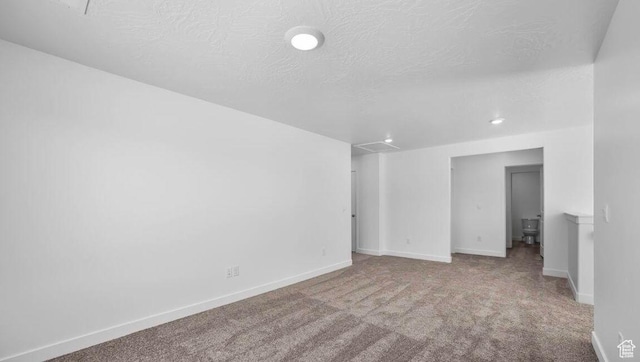 1726 S Wolverine Way Unit 174, Washington, UT 84780 - spare room with baseboards, recessed lighting, carpet floors, and a textured ceiling