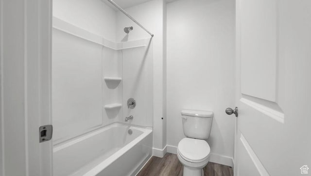 1726 S Wolverine Way Unit 174, Washington, UT 84780 - bathroom featuring bathing tub / shower combination, wood finished floors, toilet, and baseboards
