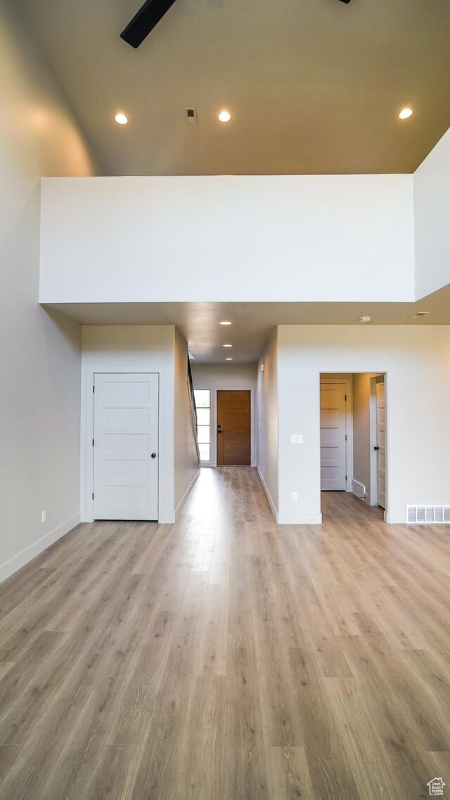 954 W 1880 S, Syracuse, UT 84075 - unfurnished living room with light wood-style floors, visible vents, and recessed lighting