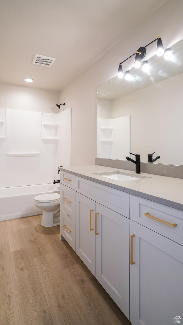 954 W 1880 S, Syracuse, UT 84075 - full bath featuring visible vents, toilet, wood finished floors, vanity, and shower / washtub combination