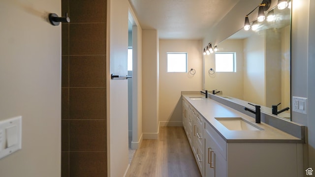 954 W 1880 S, Syracuse, UT 84075 - full bath featuring double vanity, baseboards, a sink, and wood finished floors