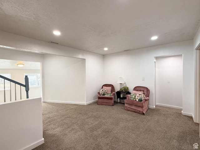 sitting room featuring carpet floors, baseboards, visible vents, and recessed lighting