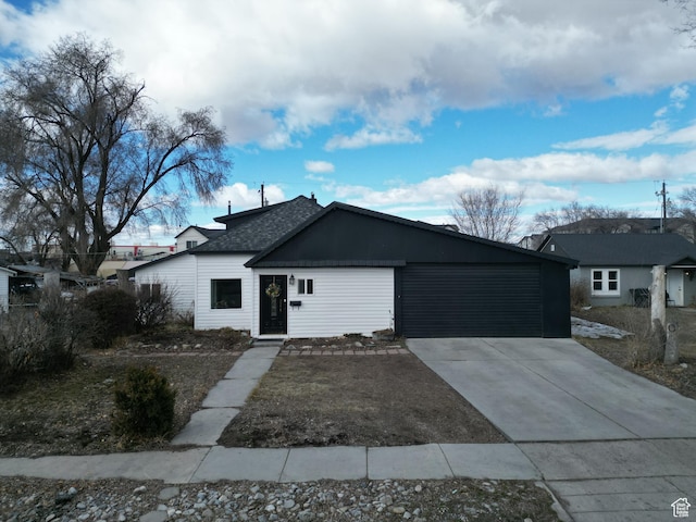 view of front of property featuring an attached garage and driveway