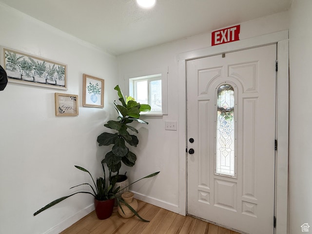 entryway featuring light wood finished floors and baseboards