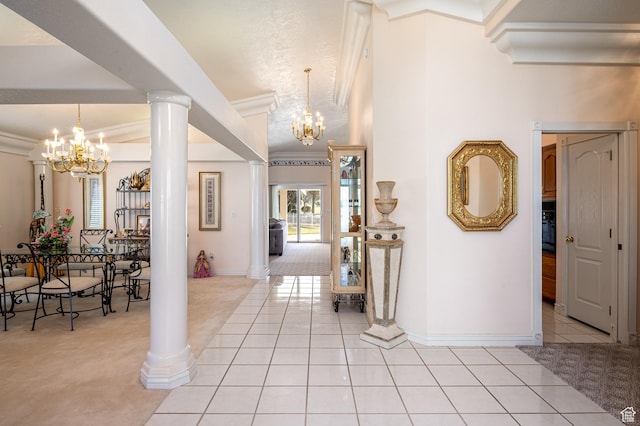 150 S Crystal Lakes Dr Unit 48, St George, UT 84770 - entryway with ornate columns, light tile patterned floors, ornamental molding, and a notable chandelier