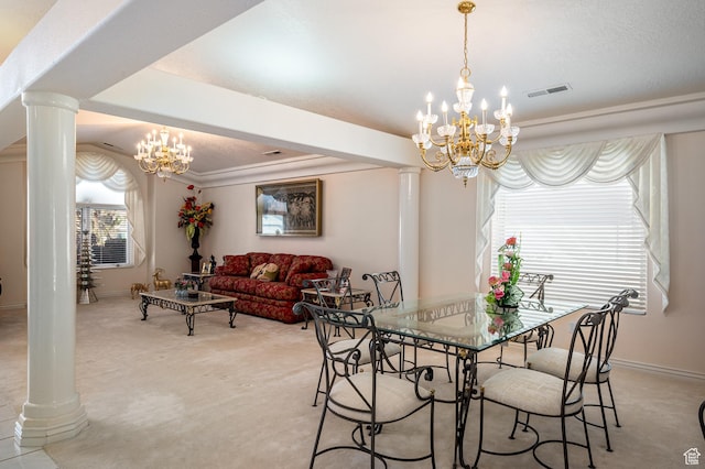 150 S Crystal Lakes Dr Unit 48, St George, UT 84770 - dining room featuring an inviting chandelier, decorative columns, visible vents, and carpet flooring