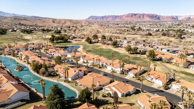 150 S Crystal Lakes Dr Unit 48, St George, UT 84770 - drone / aerial view with view of golf course, a water and mountain view, and a residential view