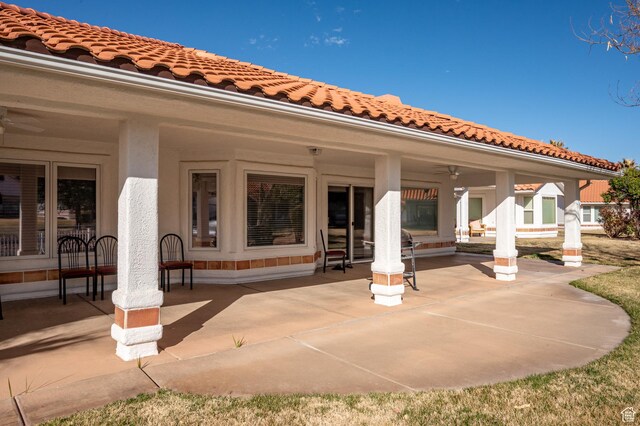 150 S Crystal Lakes Dr Unit 48, St George, UT 84770 - rear view of property featuring a patio, a tile roof, a ceiling fan, and stucco siding
