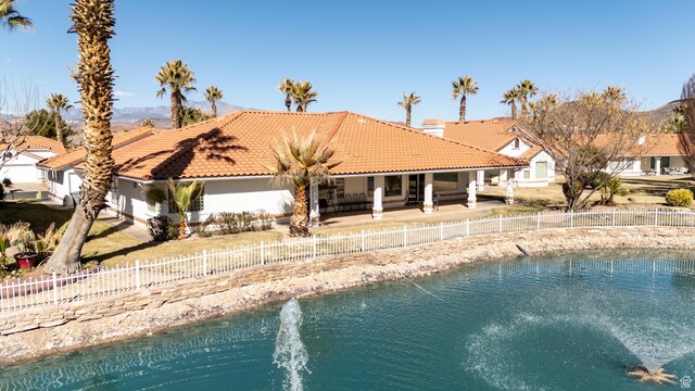 150 S Crystal Lakes Dr Unit 48, St George, UT 84770 - exterior space with a fenced backyard, a patio, and a tiled roof