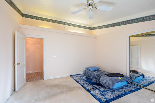 150 S Crystal Lakes Dr Unit 48, St George, UT 84770 - bedroom with carpet floors, ceiling fan, and baseboards