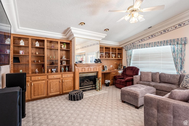 150 S Crystal Lakes Dr Unit 48, St George, UT 84770 - living area with a textured ceiling, light carpet, a fireplace with flush hearth, a ceiling fan, and ornamental molding