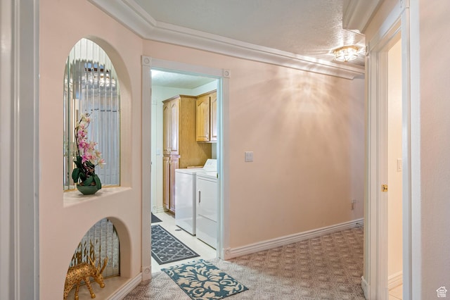 150 S Crystal Lakes Dr Unit 48, St George, UT 84770 - hallway featuring baseboards, ornamental molding, light colored carpet, and washer and dryer