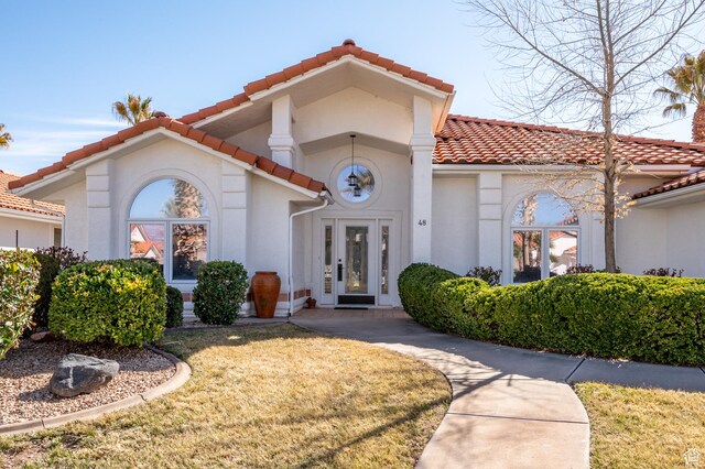 150 S Crystal Lakes Dr Unit 48, St George, UT 84770 - mediterranean / spanish home with a tile roof and stucco siding
