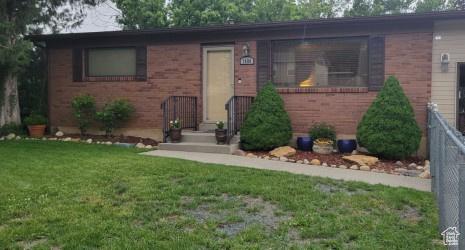 7688 S 1130 E, Midvale, UT 84047 - view of front of property with a front lawn