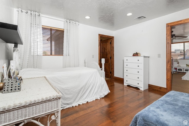 892 S Cambridge Dr, St George, UT 84770 - bedroom with wood finished floors, recessed lighting, baseboards, and a textured ceiling