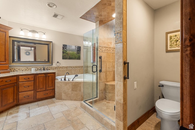 892 S Cambridge Dr, St George, UT 84770 - full bath with a stall shower, vanity, a garden tub, stone tile floors, and toilet