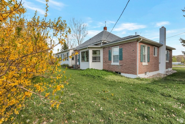 175 W 9200 S, Paradise, UT 84328 - back of property with a lawn, a chimney, and brick siding