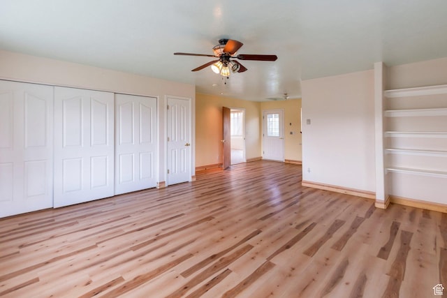 175 W 9200 S, Paradise, UT 84328 - unfurnished bedroom with baseboards, ceiling fan, two closets, and light wood-type flooring