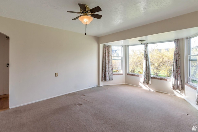 175 W 9200 S, Paradise, UT 84328 - empty room with carpet flooring, arched walkways, baseboards, and ceiling fan