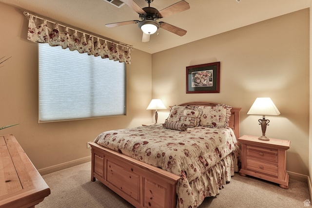 bedroom featuring light carpet, ceiling fan, and baseboards