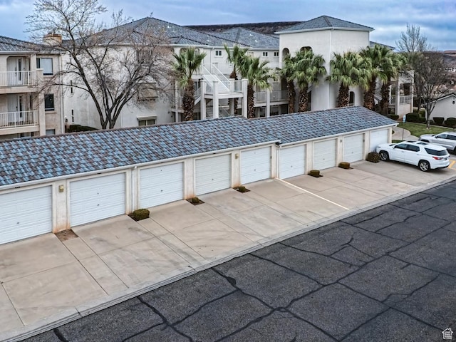 view of home's community with a residential view and community garages