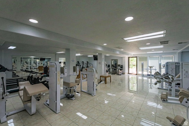 workout area with light tile patterned flooring, visible vents, and recessed lighting