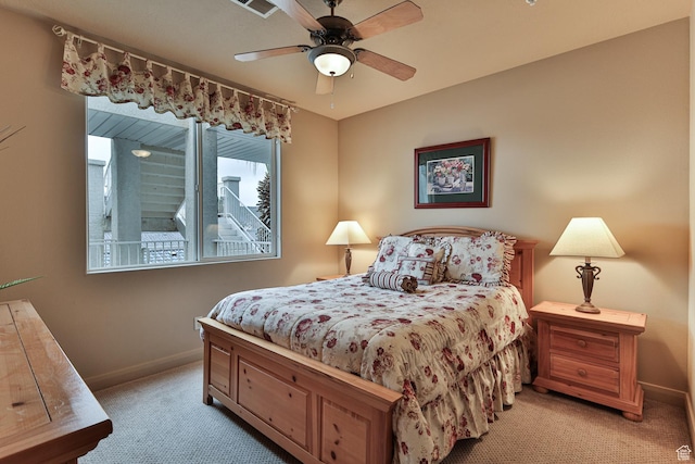 bedroom featuring light carpet, baseboards, and a ceiling fan