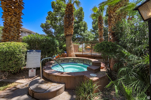 view of pool featuring a hot tub