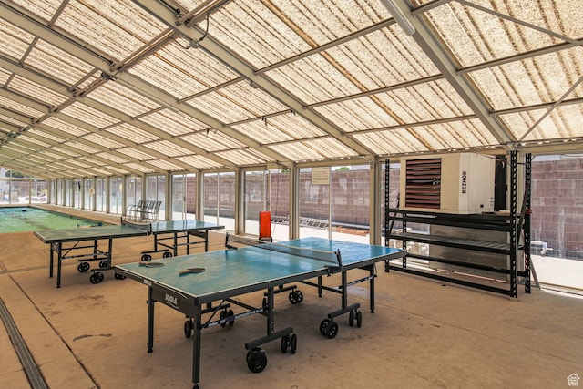 recreation room with concrete flooring