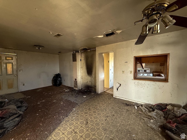spare room with visible vents and a ceiling fan