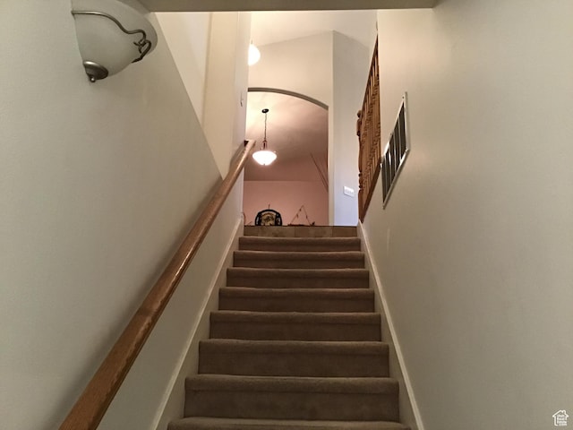 stairs featuring arched walkways